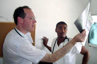Dr. Paul Farmer examines a patient.