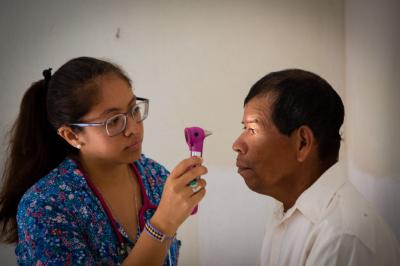 Eye doctor testing patient