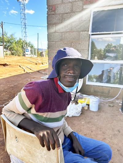 Kaizer Mahapa outside of his home in Lesotho.