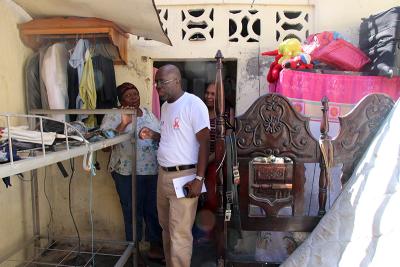Père Eddy provides support for ZL Nurse Anesthetist Fatimah Barnate and her mother after Hurricane Matthew destroyed their home in 2016.