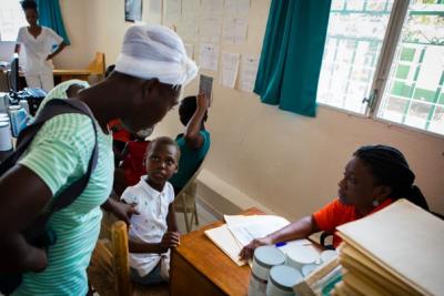 Child waiting for malnutrition consultation in Haiti.