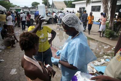 In Haiti, a patient receives treatment for cholera.