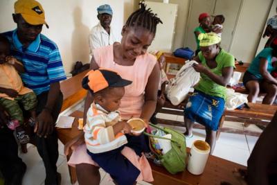 Child waiting for malnutrition consultation in Haiti. 