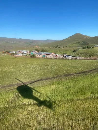 Helicopter landing at the remote PIH primary care site of Bobete. 