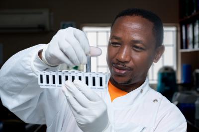 Ntate Rethabile holding a test tube