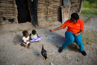 Haiti Malnutrition, CHW helping family