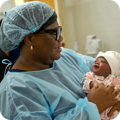 Sister Patricia holds Sia’s baby shortly after birth. 