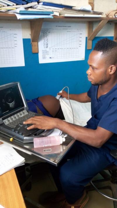 a Ministry of Health nurse midwife, performs an ultrasound on a pregnant patient