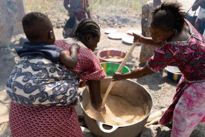 Women combine the fish and rice with Bennimix, a locally available food supplement