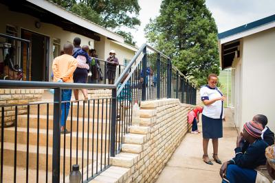 People standing outside of St. Peter’s Health Center in Butha-Buthe District, Lesotho