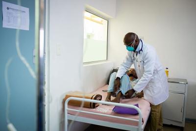 Doctor examines multidrug-resistant tuberculosis (MDR-TB) patient, Lesotho