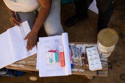 Mats’epang Marito, treatment supporter, and Marumo, review Mokone’s MDR-TB treatment regimen.