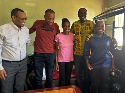 Sarafina Makashane (center) with members of her tuberculosis care team at her home in Maseru, Lesotho. From left to right: PIH Lesotho Chief Medical Officer Dr. Afom Andom, PIH Lesotho Intensive Care Unit Specialist Dr. Ninza Sheyo, PIH Lesotho Executive Director Dr. Melino Ndayizigiye, and Treatment Supporter Litlhare Matlole.