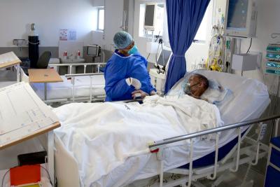 Janki Moneni, a 61-year-old MDR-TB patient, receives care in an ICU at Botšabelo Hospital in Maseru, Lesotho.