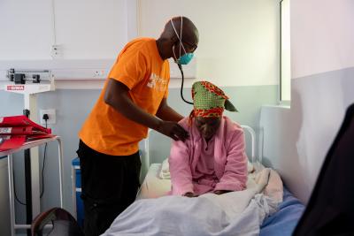 Dr. Sebakeng Phate, multidrug-resistant tuberculosis (MDR-TB) associate lead, examines MDR-TB patient Majanki Lesako.