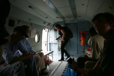 Dr. Sheila Davis descends from a United Nations helicopter during the Ebola response in Monrovia, Liberia