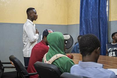 Peter J. Wallace (left) co-facilitates a weekly peer support group session on Aug. 8, 2026.