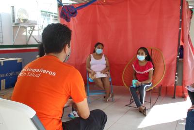 Director of health programs meets with woman in Mexico.