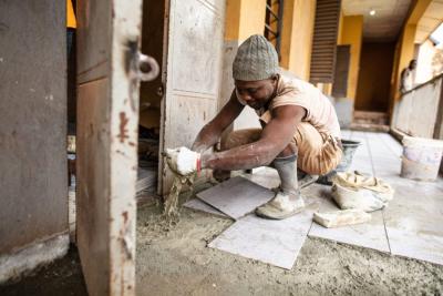 Worker building a hospital
