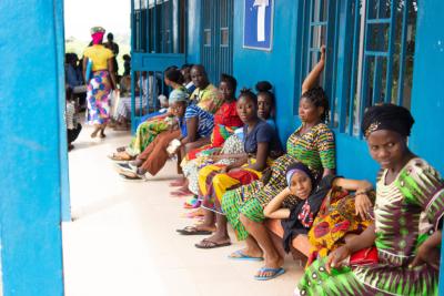 Pregnant women relax outside the antenatal care center at Wellbody Clinic, Sierra Leone