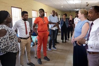 PIH Sierra Leone Executive Director Vicky Reed (third from left) with staff during a tour of the female ward at PIH-supported Sierra Leone Psychiatric Teaching Hospital in Freetown on January 17, 2024.