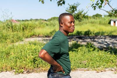 Mohamed Nao, PIH Sierra Leone's social support and patient referral coordinator, visits the grounds of the former Maforki Ebola Treatment Unit.
