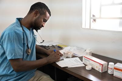 TB/HIV Program Manager Dr. Girum Tefera prepares a day’s worth of medication for patients with multidrug-tuberculosis.