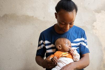 Phebian Baningo holds her daughter Grace on April 17, 2026.