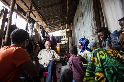 Dr. Paul Farmer visits Ebola survivor Yabom Koroma and her family at their home in the Mountain Court section of Freetown, Sierra Leone.