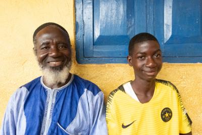 Cancer patient with his father in Sierra Leone. 