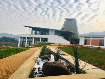 Wavy clouds form a scenic backdrop for UGHE’s administration building