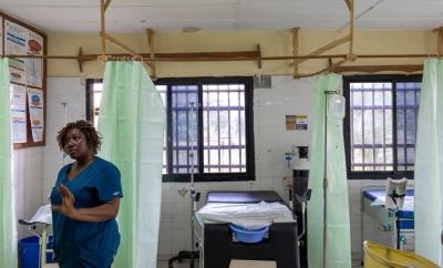 Nurse Midwife Isata Dumbuya stands in the delivery room at Koidu Government Hospital in Kono, Sierra Leone.