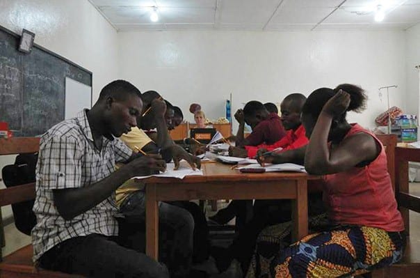 LIBERIA - JUNE 2015: Tubman University nursing graduates study for their licensing exams.