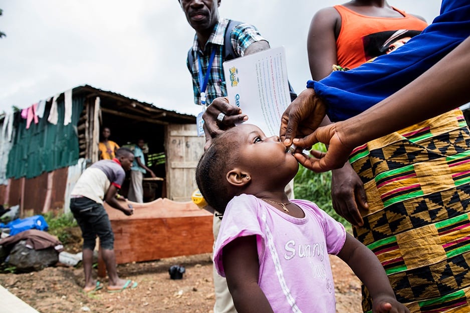 Fatu Kamara receives the first of two doses of oral cholera vaccine in Freetown, Sierra Leone.