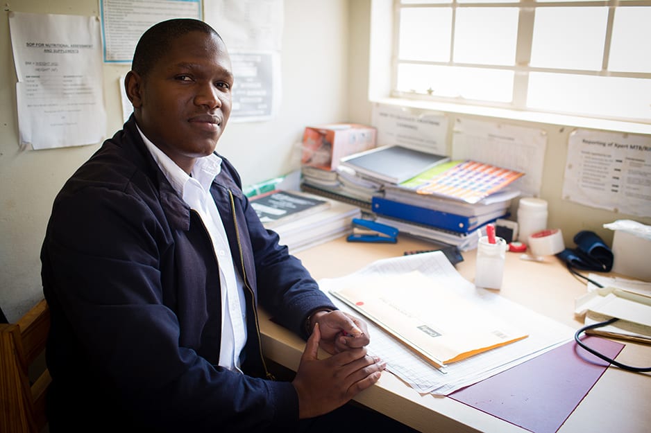 Atlehang Seisa sits in his office at the Mapheleng Health Center