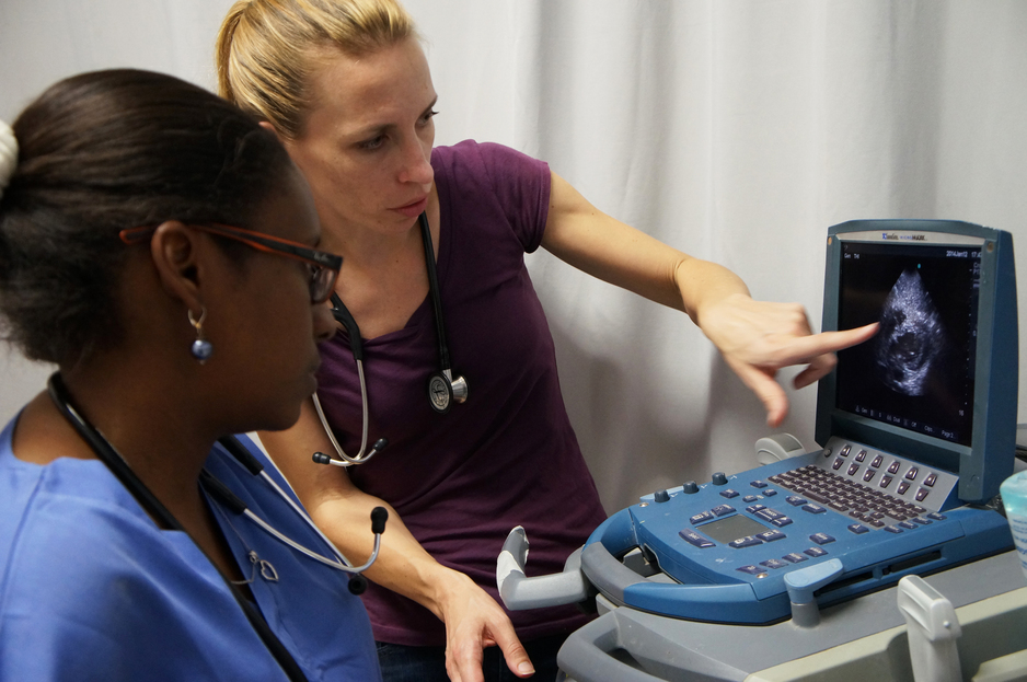 Dr. Cassandre Edmond and Dr. Regan Marsh review an ultrasound for a patient