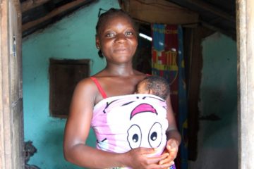 Cecile Johnson's daughter holds her daughter Sheba as part of the kangaroo mother care program