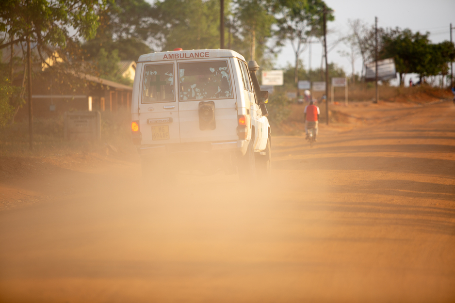 An ambulance leaves a cloud of dust on the main road near PIH-supported Neno District Hospital, where a recent emergency care assessment will inform planning and improvements for COVID-19 and far beyond. (Zack DeClerck / PIH)