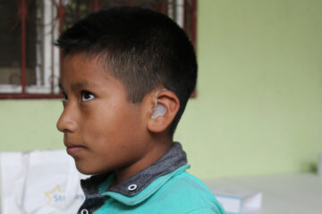 Rusbin Gómez, 9, has been hard of hearing his whole life and recently received hearing aids, thanks to support from PIH in Mexico. (Photo by Paola Rodriguez / Partners In Health)