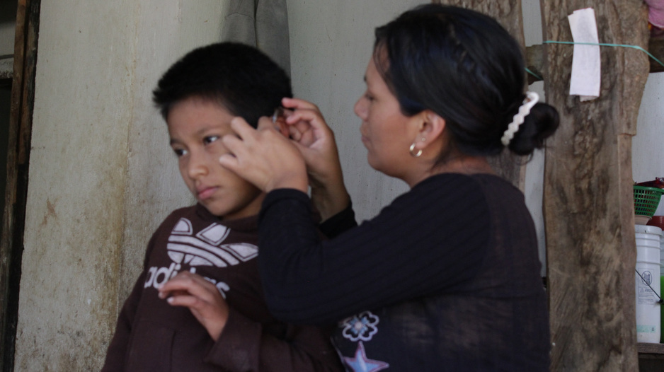 Through support from PIH and years of advocacy by his parents, Rusbin Gómez went home with hearing aids for the first time in his life. (Photo by Paola Rodriguez / PIH)