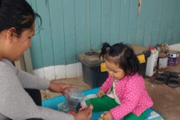 Rocío Salas and her daughter, Valentina, practice coordination skills learned through The CASITA Project focused on child development.