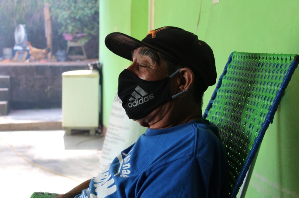 Armando Torres, a patient who has recovered from COVID-19, resting at home in rural Chiapas and wearing a face mask. (Photos by Paola Rodriguez / Partners In Health)